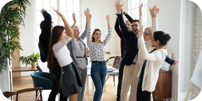 Photo of a group of colleagues celebrating a challenge