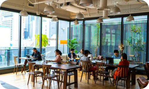 Coworking space with tables and people working independently
